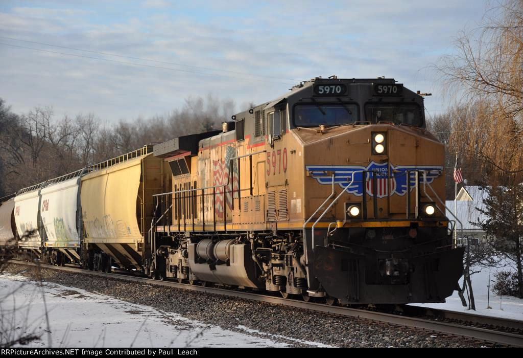 Grain train rolls east